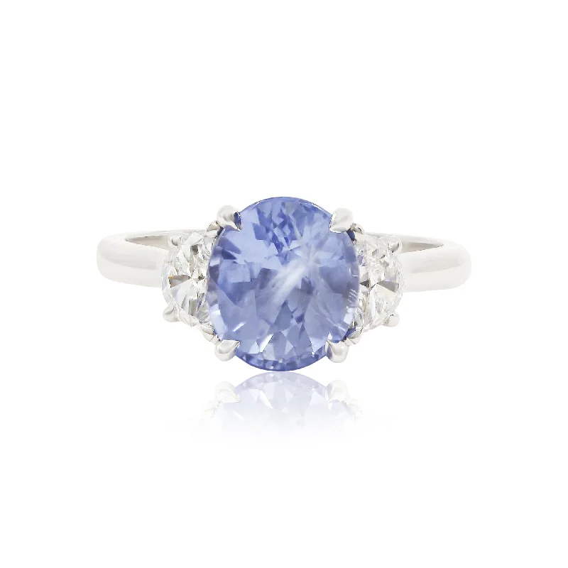 Oak grain rings-114K WHITE GOLD OVAL BLUE SAPPHIRE AND HALF-MOON DIAMOND THREE-STONE RING