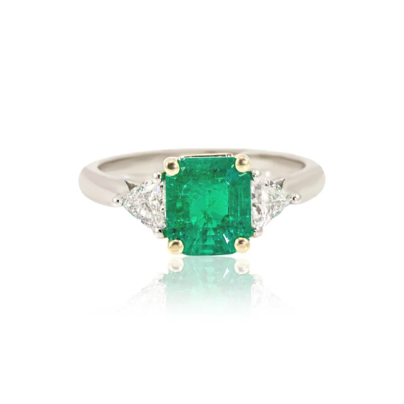 Angled shank rings-PLATINUM AND 18K YELLOW GOLD EMERALD AND TRILLIANT CUT DIAMOND THREE-STONE RING